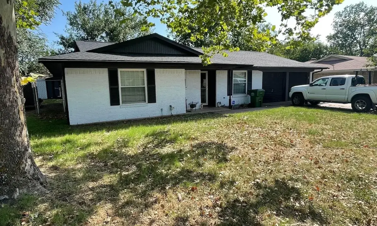 Professional roofing crew working on a residential roof in Norco